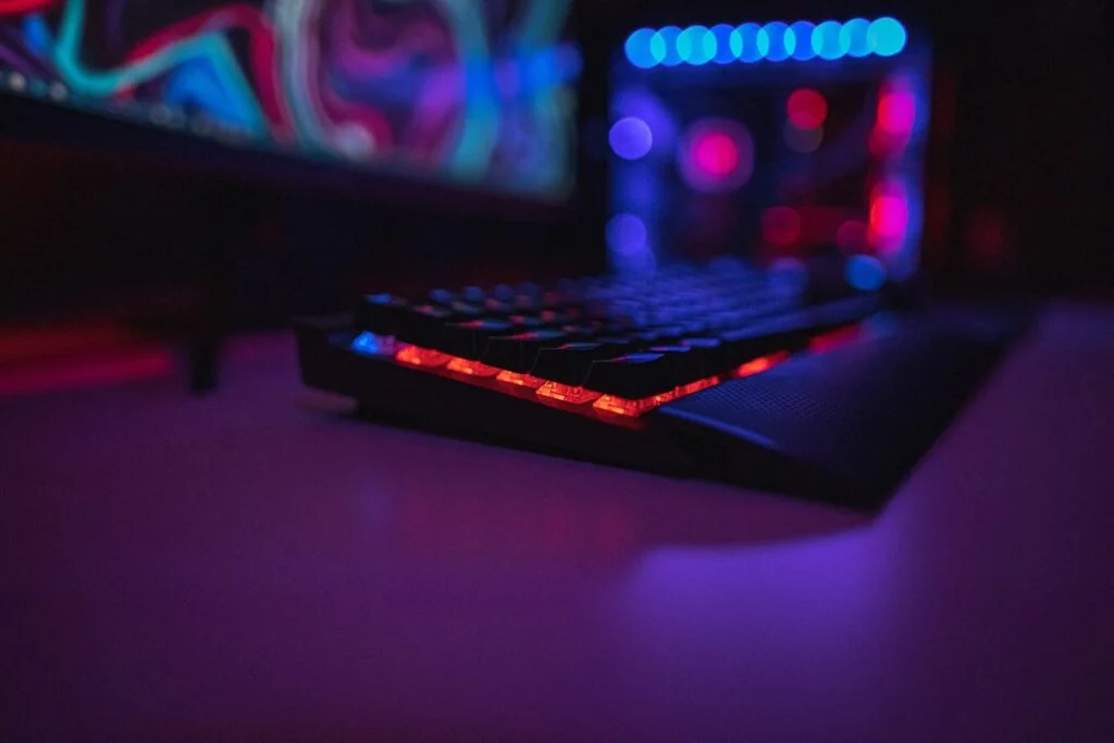 Gamer keyboard on neon lit table